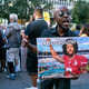 Eric Hamilton of New York City joins others gathered in support of unsigned NFL quarterback Colin Kaepernick on Aug. 23, 2017, in front of NFL headquarters in New York City. (Craig Ruttle/AP Images)